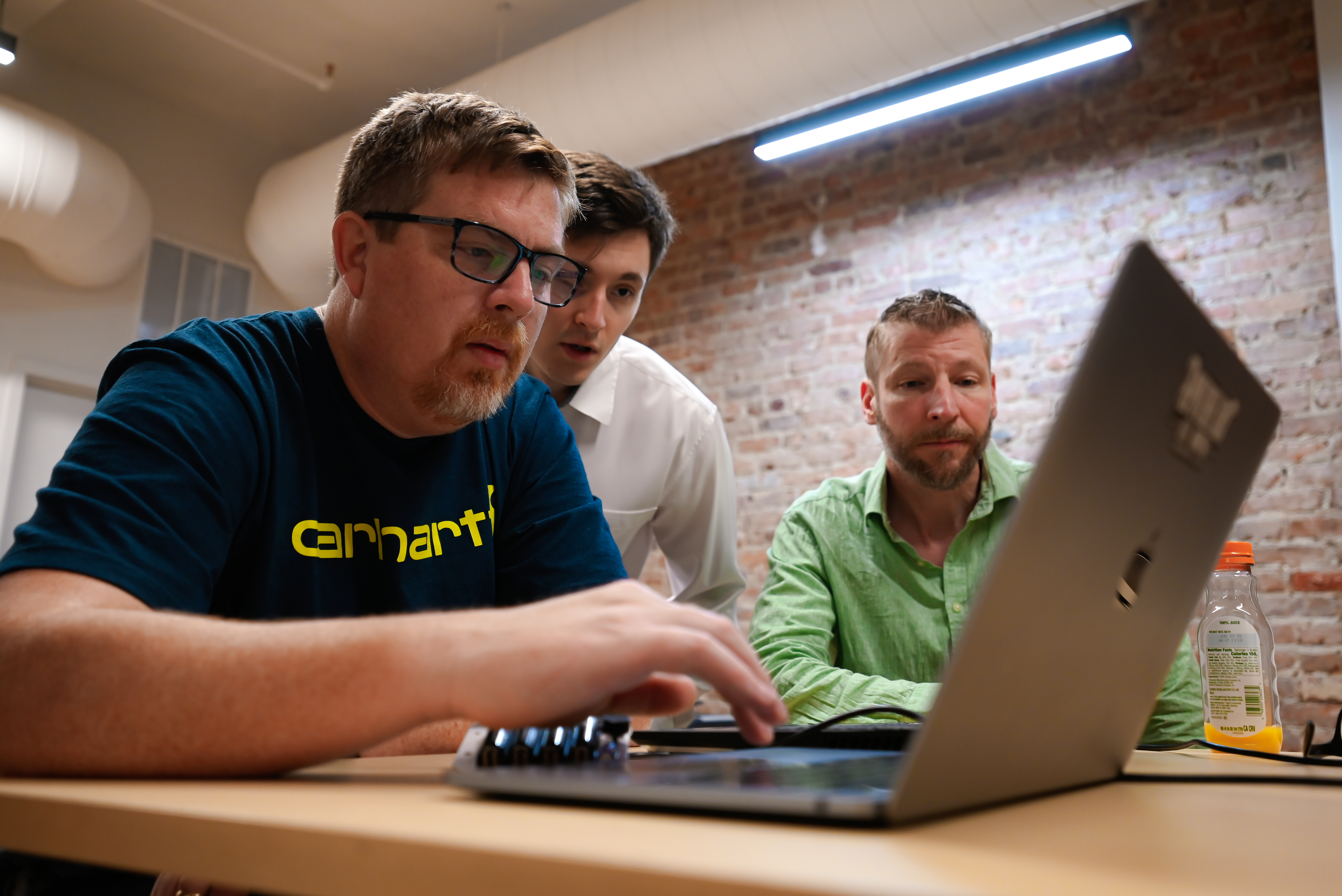 Close-up collaboration at a laptop