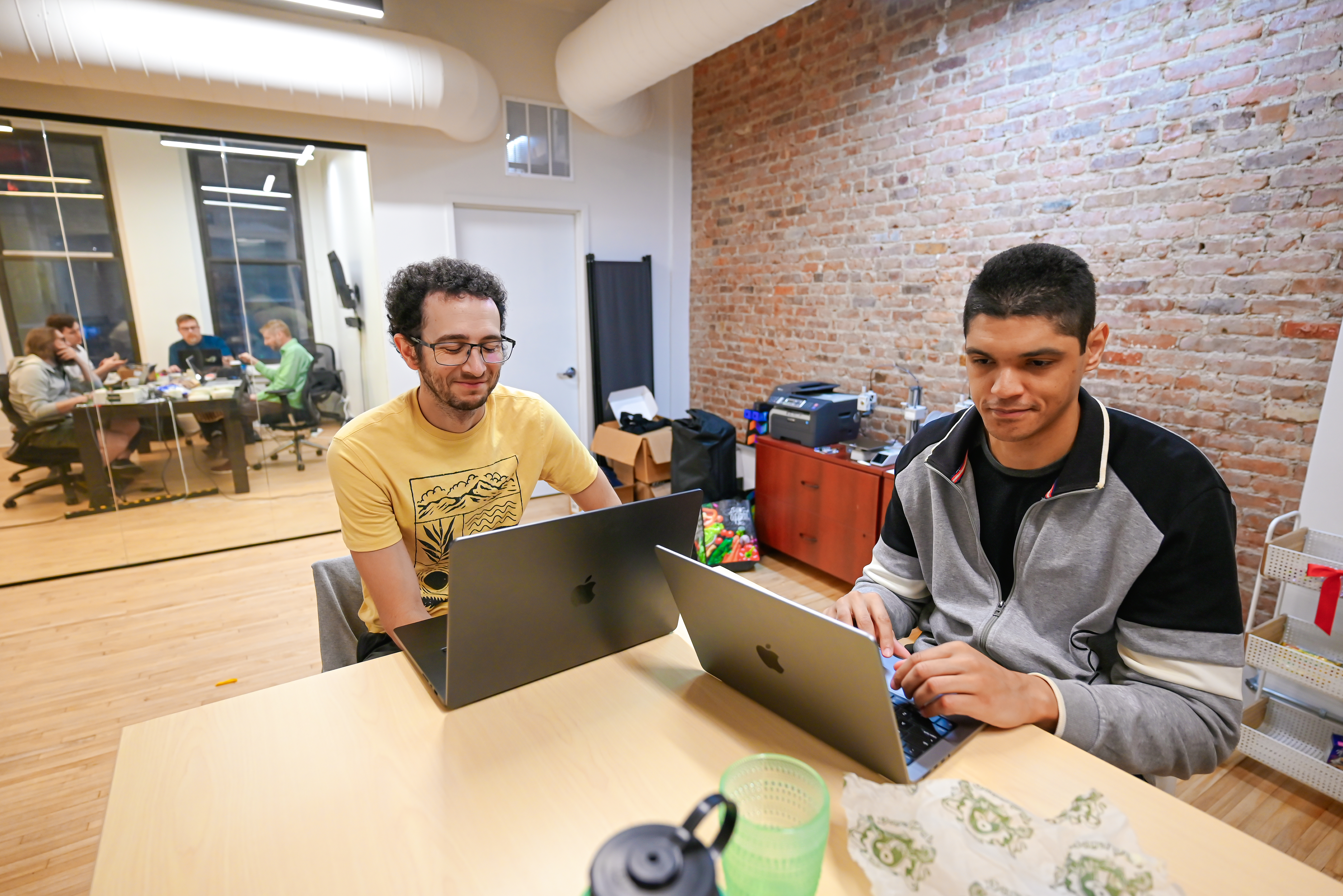 Engineers working on laptops in the office