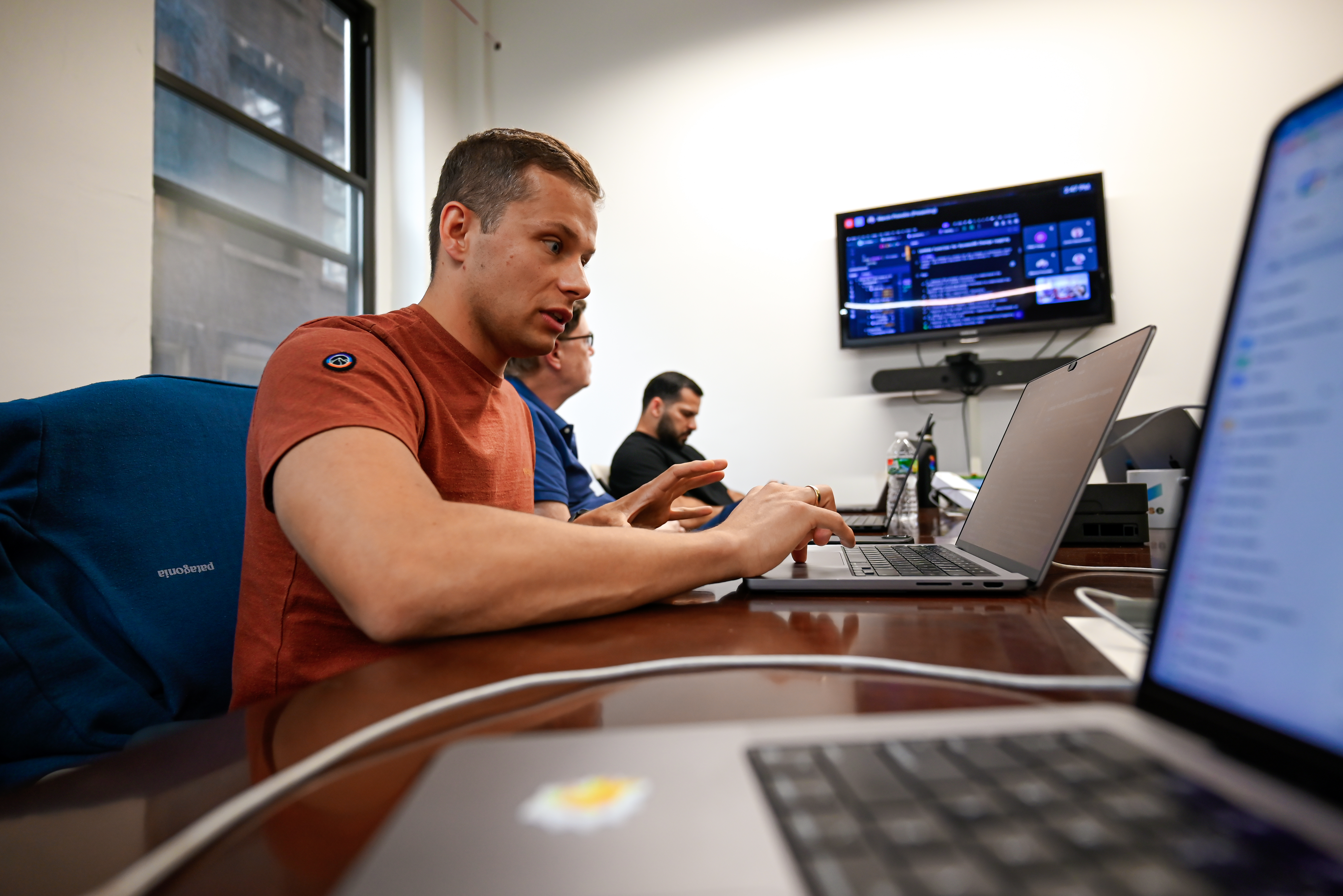 Engineer at laptop with dashboard